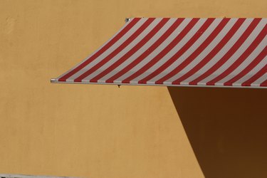Striped awning on wall