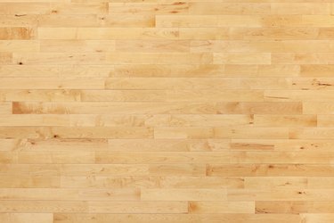 Hardwood basketball court floor viewed from above