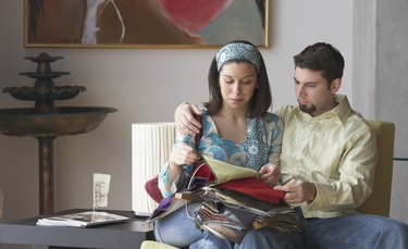 Young couple looking at fabric swatches
