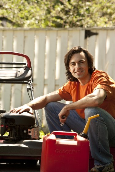 man with lawn mower