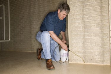 Man spraying crevices