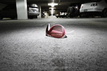 Sunglasses on concrete in parking garage (focus on sunglasses)