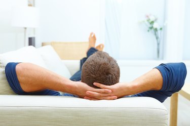 Portrait of male resting at home on his couch