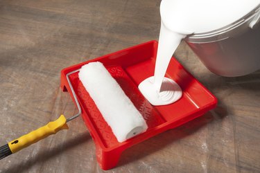 Pouring Paint In A Paint Tray