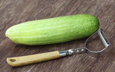 Fresh cucumber with peeler