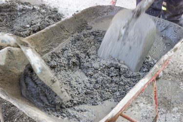 mixing the cement in wheelbarrow