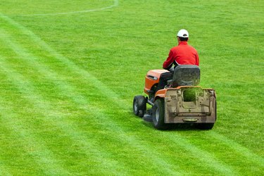 Mowing grass in stadium