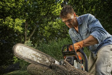 Man sawing a log