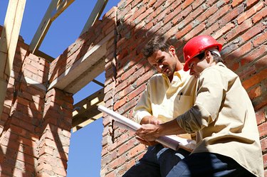 Contractor and client at construction site