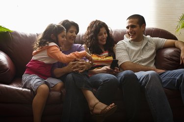 family laughing at cell phone