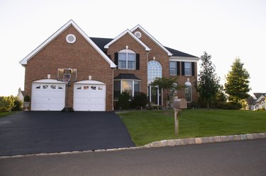 A newly paved driveway can increase your home's curb appeal.