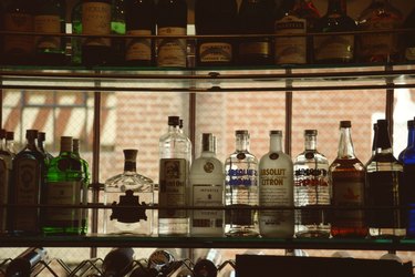 Liquor bottles in bar window