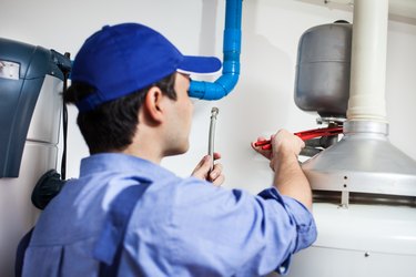 Technician repairing an hot-water heater