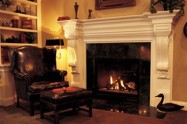 Leather chair in front of fireplace