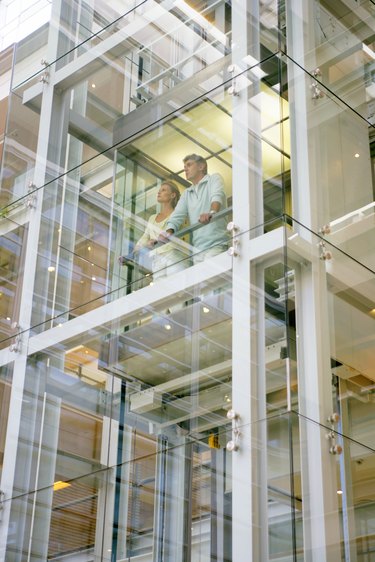 People in a glass elevator