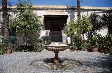 Bird bath on mosaic tile