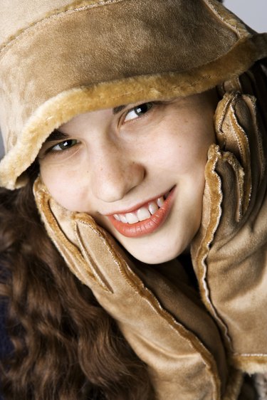 Teenage girl in hat and gloves