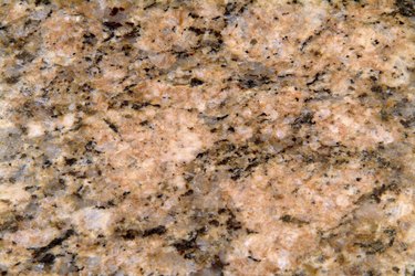 Close-up of surface texture of pink granite rock