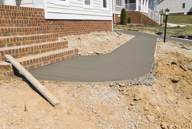 Wet cement walkway at construction site