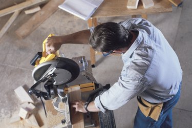 Construction worker using circular saw