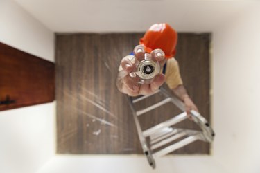 Electrician Is Mounting A Bulb