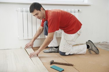 carpenter worker joining parket floor