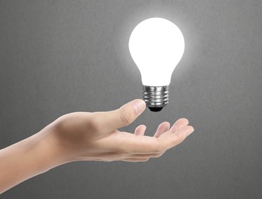 Ideas bulb light on  hand