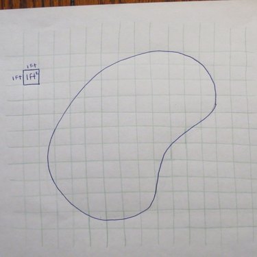 Kidney-shaped pool sketched on grid paper.