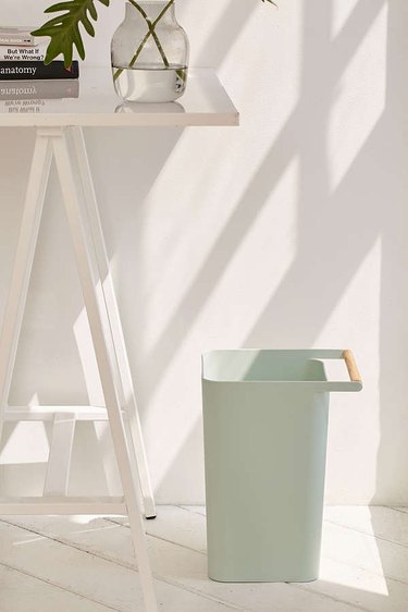 mint green rounded edge square trashcan with wooden handle