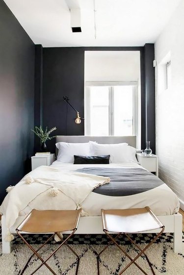 small bedroom with black wall paint