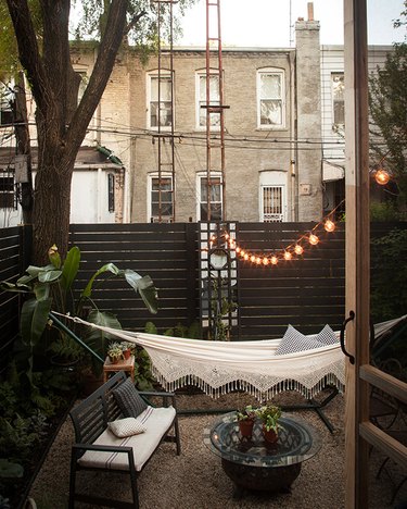 outdoor patio with hammock and lights