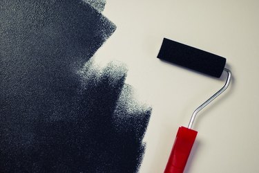 Painting a white wall black.