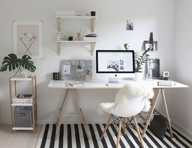 modern at home office with black and white striped rug