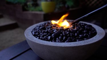 Lighting DIY tabletop concrete fire bowl.