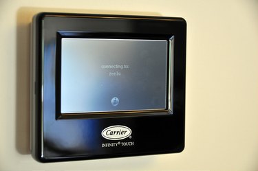Touch the screen to wake up your Carrier thermostat.