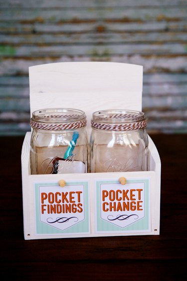 Two mason jars, one saying "Pocket Change" and one saying "Pocket Findings"