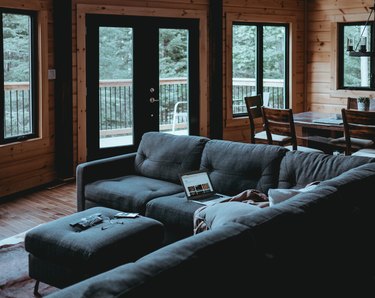Wood paneling in dark living room.