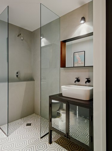 Photo of bathroom with glass walk-in shower.