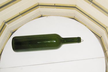 Melt the bottle in the kiln at 1,450 degrees for one hour.