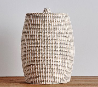 Woven laundry hamper with lid