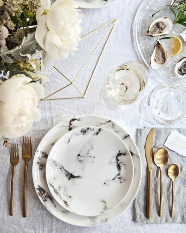 modern tablescape with gold flatware