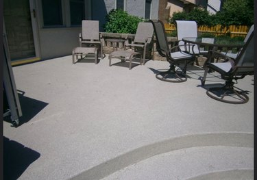 A concrete pool patio.