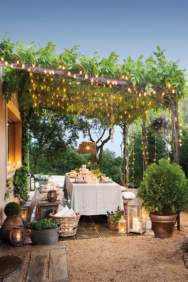 outdoor dining area with pergola lights