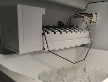 Icemaker filling the ice tray.
