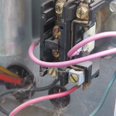 Wires connected to contactor block on a centeral air conditioner.
