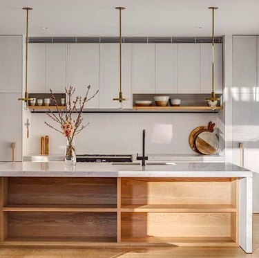 minimal brass exposed bulb kitchen