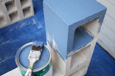The paint will seal the concrete blocks.