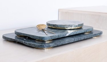 green marble trays with brass feet