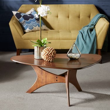 Sculptural wood coffee table with irregular triangle surface