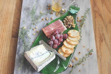 Use your new flattened wine bottle to prepare an elegant cheese plate.